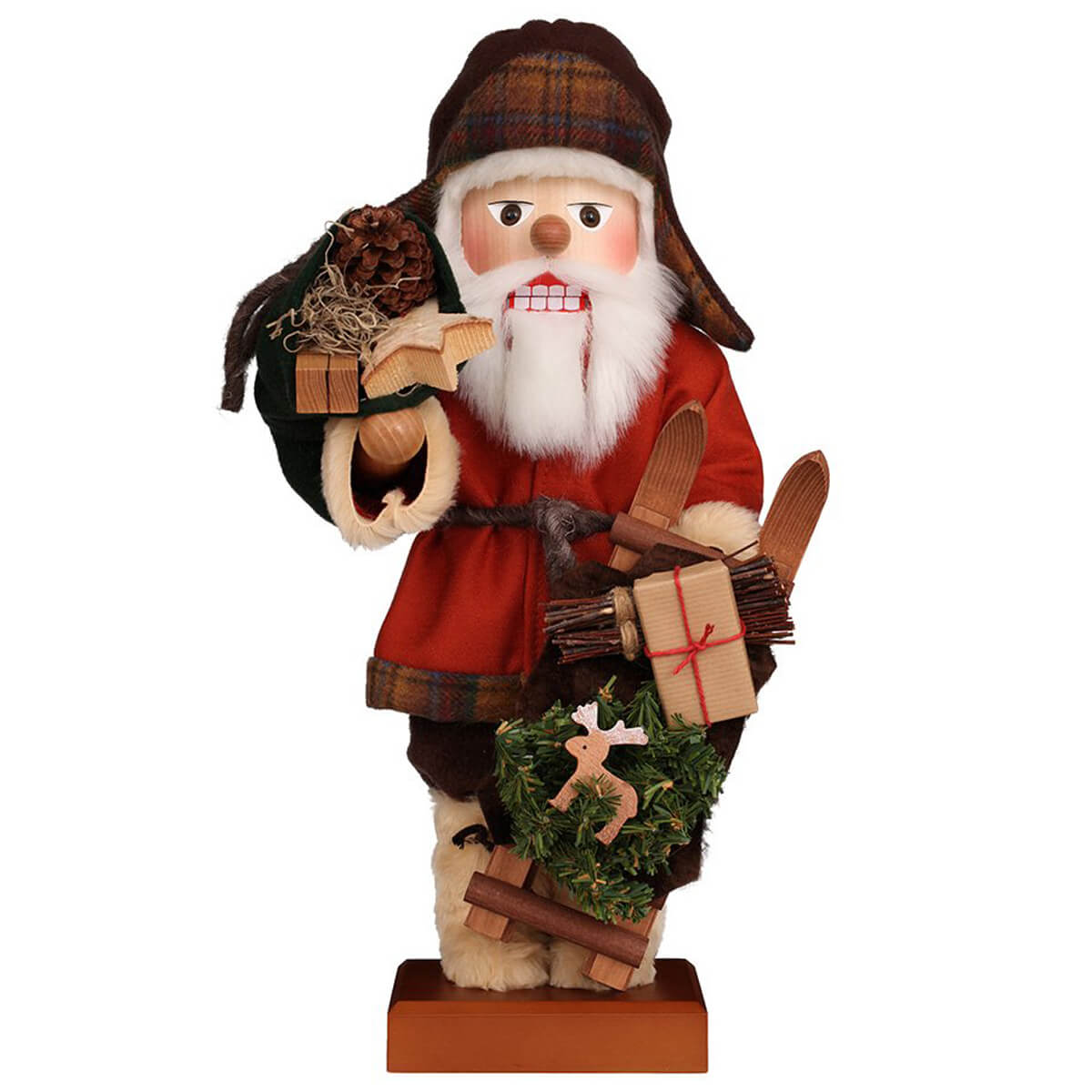 Ulbricht Swedish Sami Santa Nutcracker in his red coat, earflap hat and decorated sleigh in hand he is on his way to bring presents to the children.