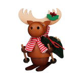Ulbricht Moose Smoker (Incense burner) on skis with holly decoration on his antlers and red and white scarf around his neck. Over his shoulder he carries a gift bag