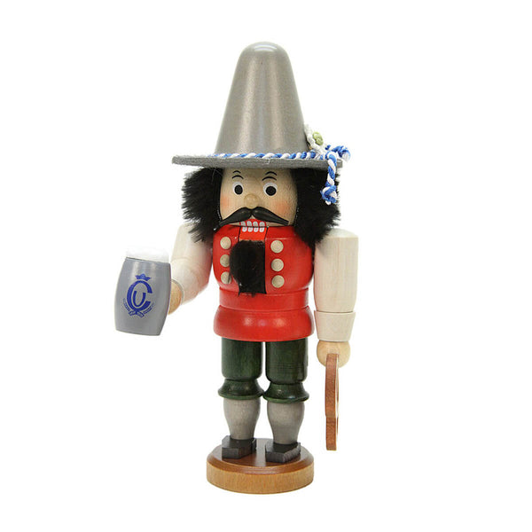 Handcrafted Bavarian nutcracker by Ulbricht with a grey hat, red jacket, dark green shorts, holding a beer stein and pretzel, made in Germany’s Erzgebirge.