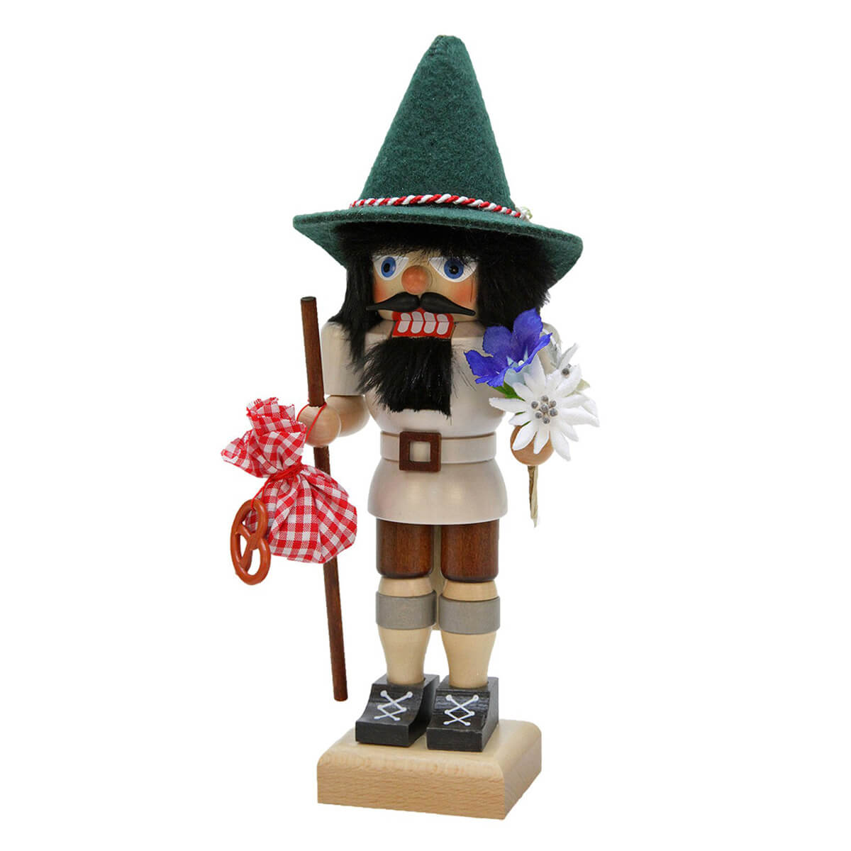 This Christian Ulbricht hiker with a bouquet of Edelweiss and Enziean in one hand and his snack with a pretzel and his walking stick in the other is ready for the ascent of the mountain.