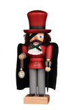 From the German story the Nutcracker and the Mouse King, comes Uncle Drosselmeier. This hand carved Christian Ulbricht Nutcracker is wearing his trademark eyepatch, a large red top hat, red jacket and his gold watch and chain. Over his jacket he is wearing a black cape. He is carrying a black cane topped with a golden circular handle