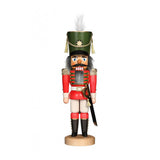 Glazed soldier nutcracker in a red and white outfit, with a sword, and wearing a green hat.