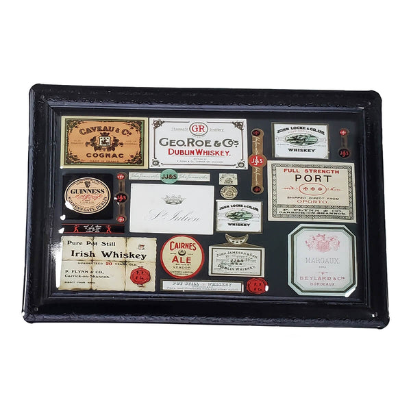 Vintage metal sign advertising different whiskey, cognac, and ale labels.