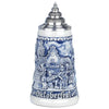 King Beer Stein with three musicians play in front of the town hall and in the background you can see a decorated maypole. 