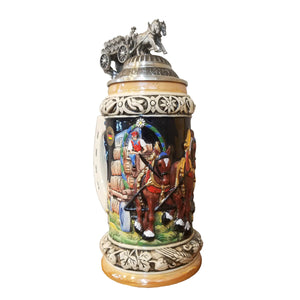 On this King Beer Stein is a nicely decorated wagon with beer kegs on its way to the Oktoberfest. On top of the pewter lied is the same wagon in 3D