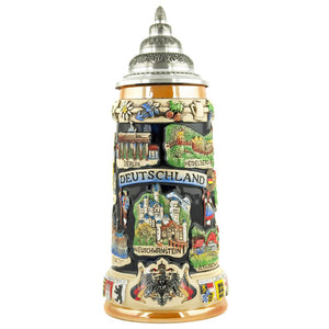 King Beer stein with a pewte Lid. There is a banner with "Deutschland" written on it and the cities Berlin and Heidelberg plus Neuschwanstein. On the bottom rim is the German Eagle with two flags.