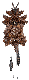 Quartz Schneider Traditional coocoo clock. A rabbit sitting on his hind legs is on the right, a pheasant looking up is on the left. Oak leaves decorate the crosshatched front of the clock. A horn encircles the dial and a hunter’s pouch decorates the bottom. The cuckoo comes out from his door above the dial. There are crossed rifles above the cuckoo and above them a stag head with antlers.