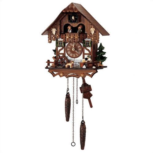 Quartz Chalet Schneider Chalet coocoo clock. A dog by a spinning water wheel on the right is watching a man sitting at a table drinking his beer. There are green trees on both sides of the house. The house is half-timbered with grey stones at the very bottom, white stucco on the lower half and the upper half is made of dark wood. Two windows beside the dial are decorated with shutters and flower boxes. The dancers spin on a balcony. Above them, the cuckoo bird comes out from behind his door. 