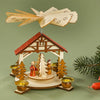 This natural-colored Pfaff Christmas pyramid is made out of wood and works with four pyramid candles. The one-tier pyramid shows the Holy Family and Nativity scene underneath a Chalet cottage-style arch. It is 6.25 inches tall.